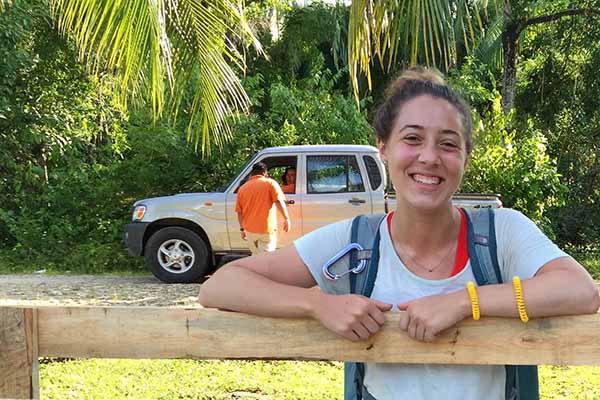 student outside in Belize smiling