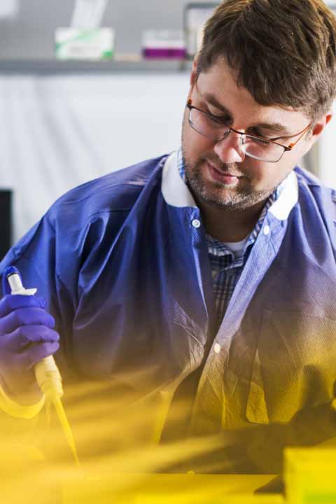 professor working in chemical lab